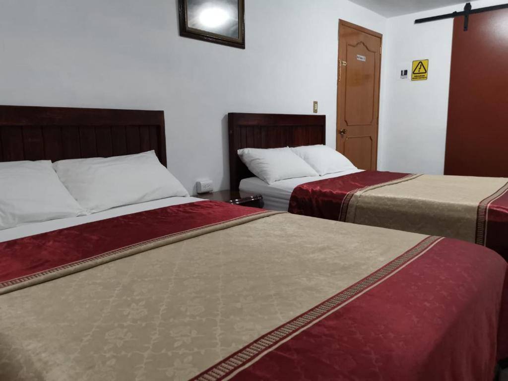 Postel nebo postele na pokoji v ubytování Hotel CALLI YOLOTL Teotihuacan