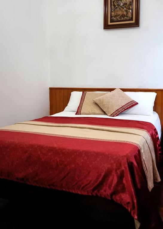 Postel nebo postele na pokoji v ubytování Hotel CALLI YOLOTL Teotihuacan