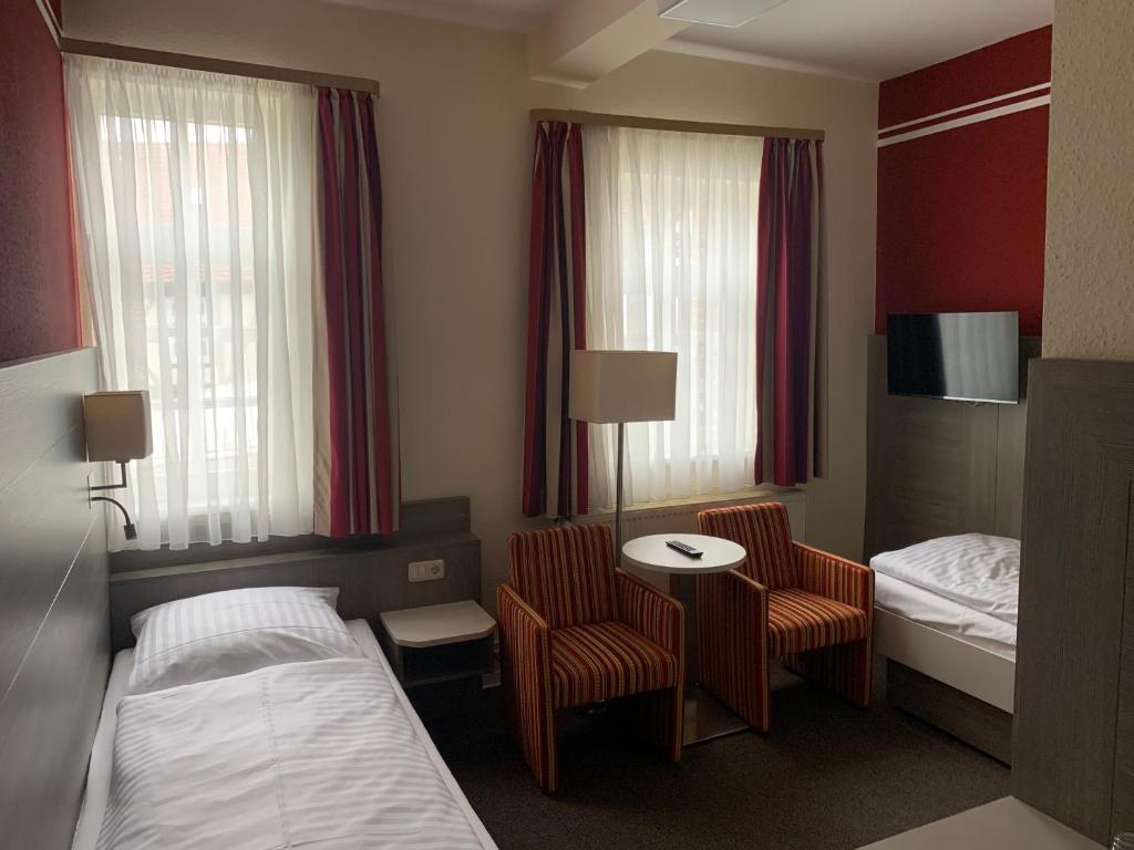 Postel nebo postele na pokoji v ubytování Hotel Goldene Krone