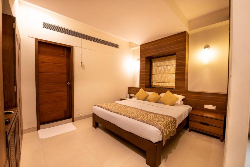 Postel nebo postele na pokoji v ubytování La-Paz Gardens Beacon Hotel - Vasco da Gama Goa