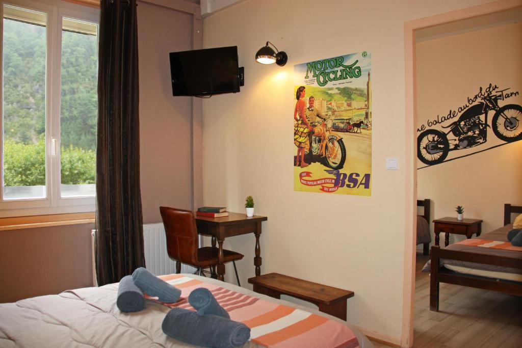 Postel nebo postele na pokoji v ubytování Hôtel des Bateliers
