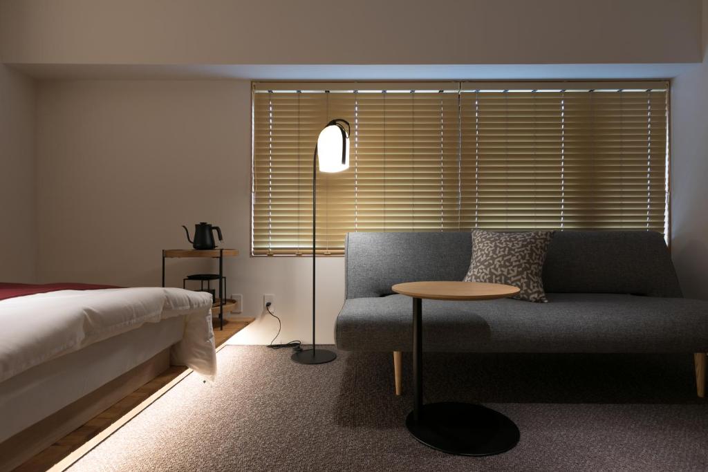 Postel nebo postele na pokoji v ubytování Design Hotel Kyoto Fuyacho