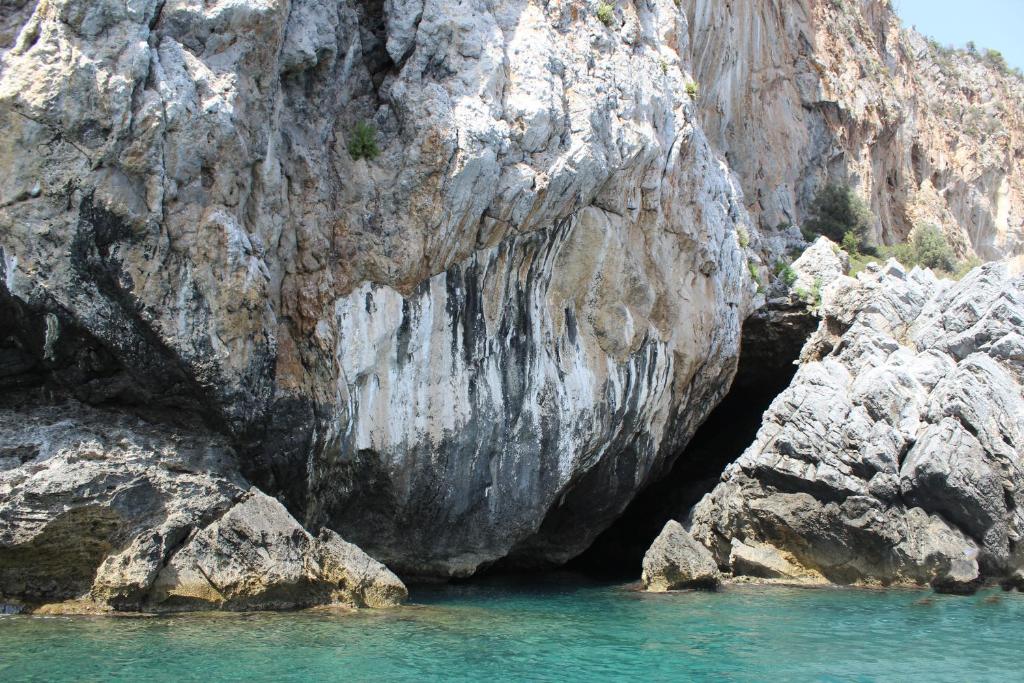 a cave in the side of a rocky cliff at IsolaDino b&b sweet home in Praia a Mare