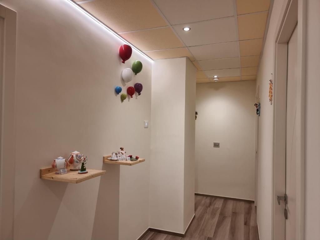 a hallway with balloons hanging on a wall at RosAmar in Bari