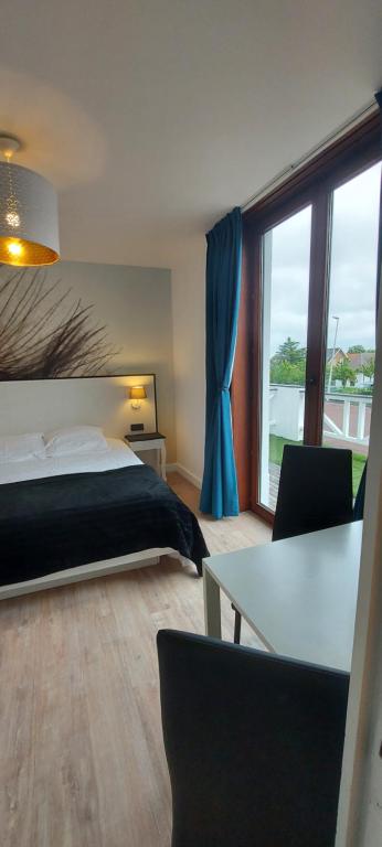 Postel nebo postele na pokoji v ubytování Hotel La Cascada