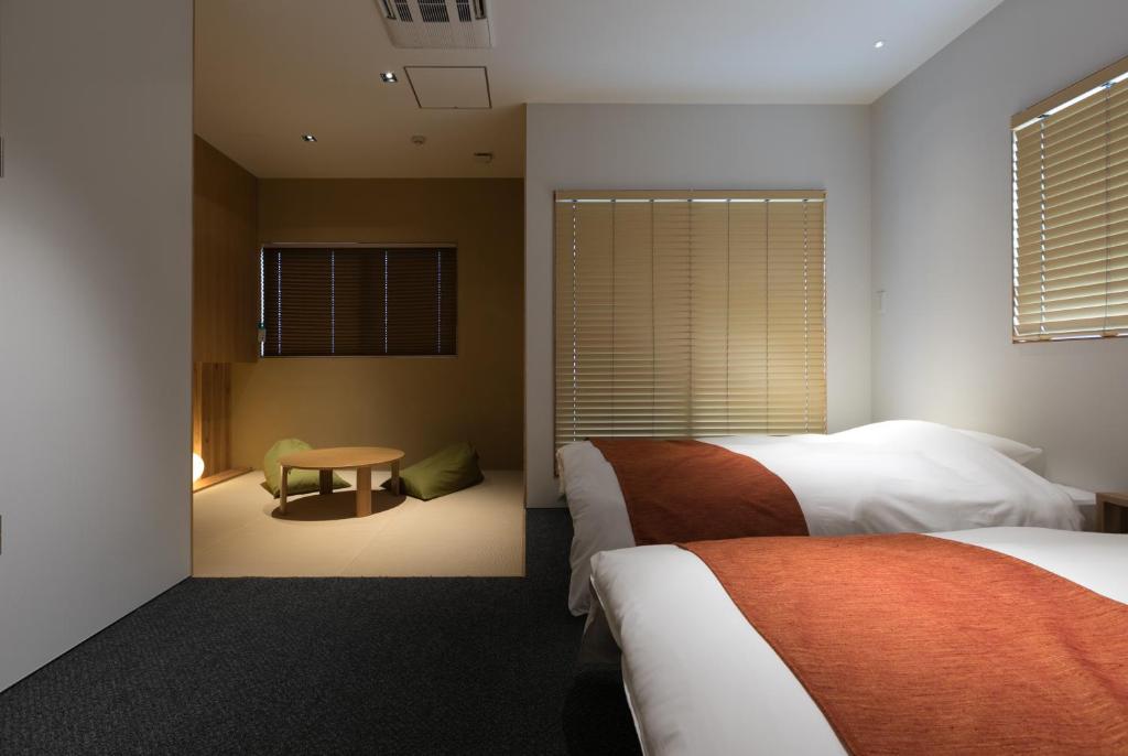 Postel nebo postele na pokoji v ubytování Design Hotel Kyoto Fuyacho