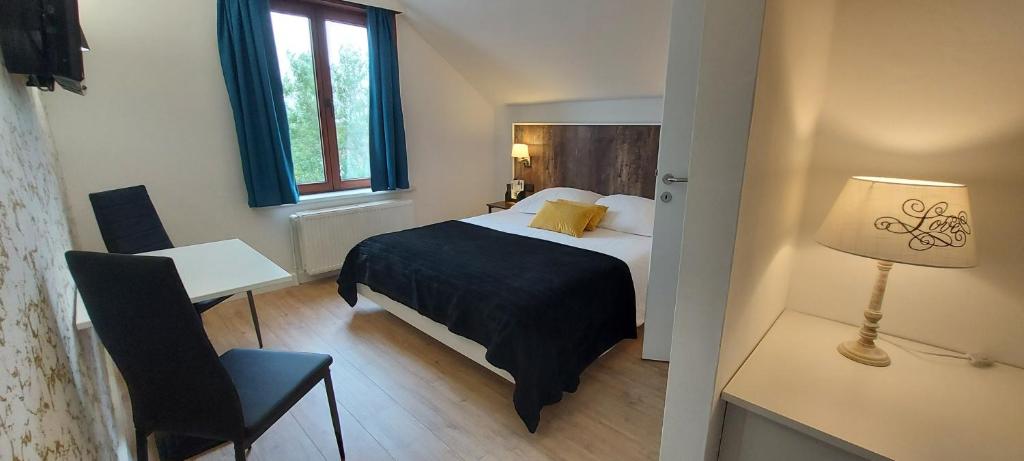 Postel nebo postele na pokoji v ubytování Hotel La Cascada