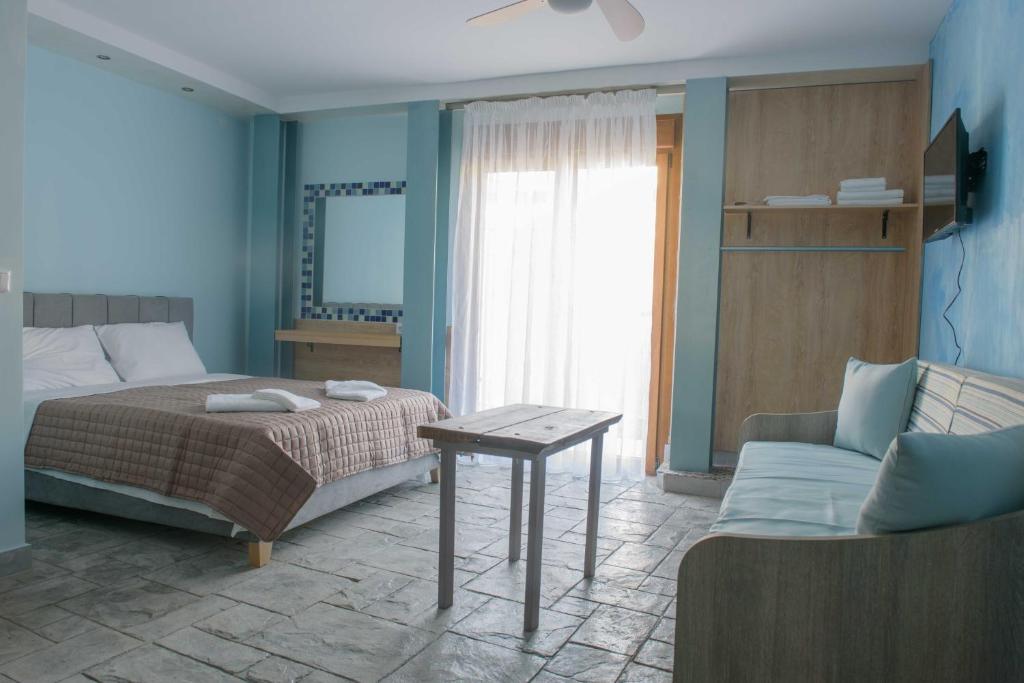 Postel nebo postele na pokoji v ubytování 3D iliadis Suites