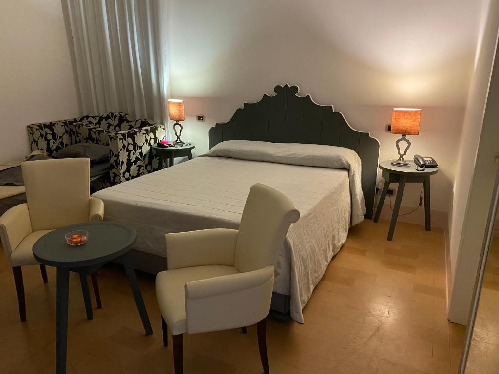 Łóżko lub łóżka w pokoju w obiekcie Relais Villa Sant'Isidoro