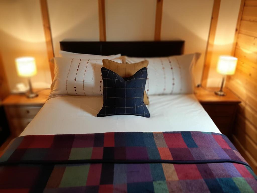 Postel nebo postele na pokoji v ubytování Tayview Lodges
