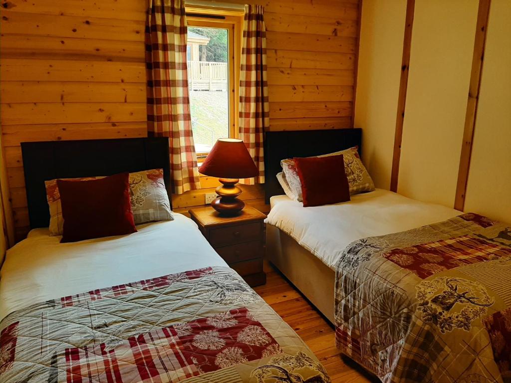 Postel nebo postele na pokoji v ubytování Tayview Lodges
