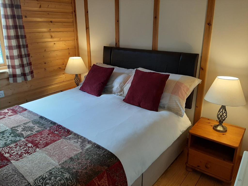 Postel nebo postele na pokoji v ubytování Tayview Lodges