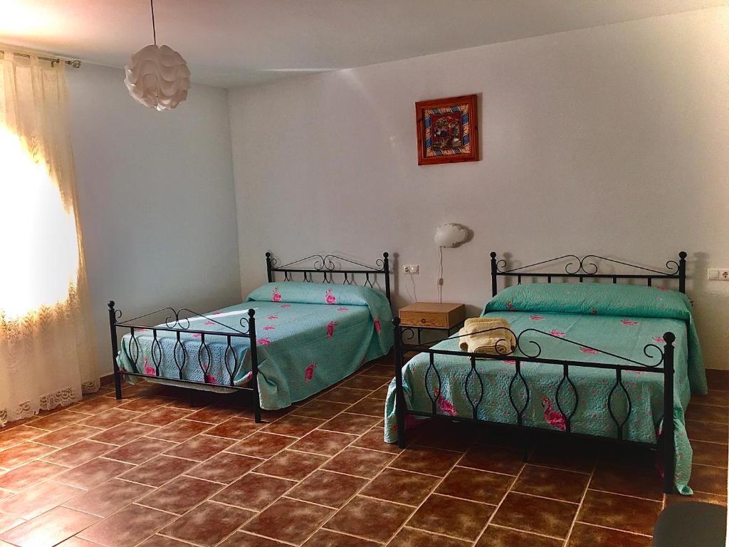 Postel nebo postele na pokoji v ubytování Casa Rural Hoyo de Los Pájaros