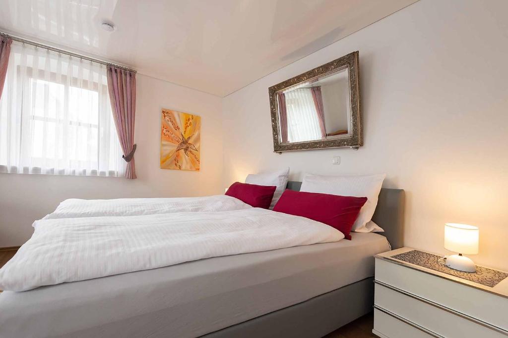 Postel nebo postele na pokoji v ubytování Ferienwohnung Nesselbachtal