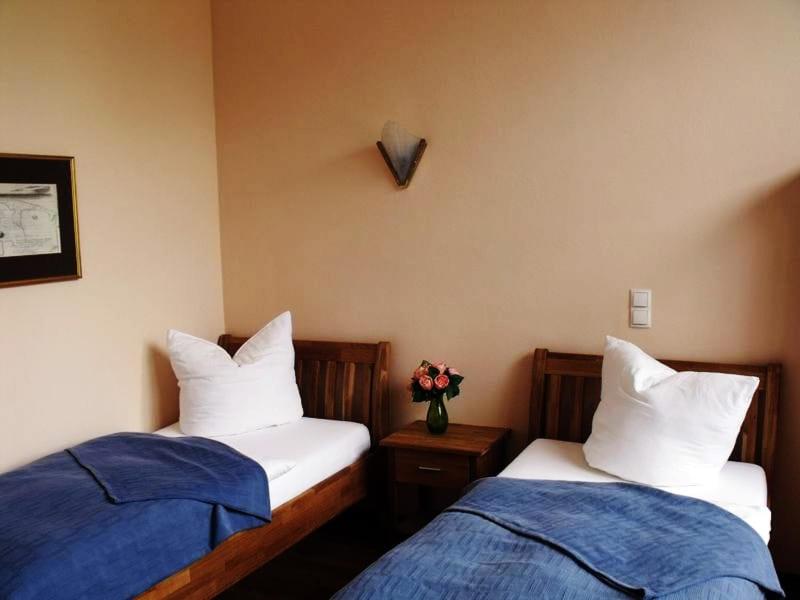 Postel nebo postele na pokoji v ubytování Hotel Alte Straßenmeisterei