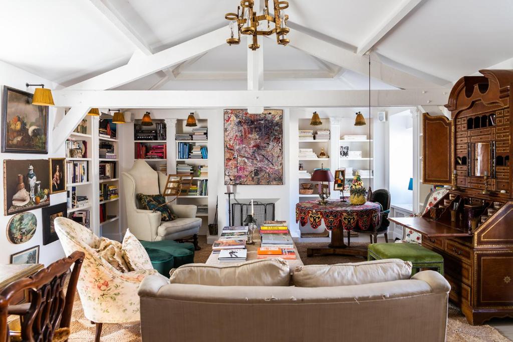 a living room with a couch and a table at Molenmeers Boutique Guesthouses in Bruges