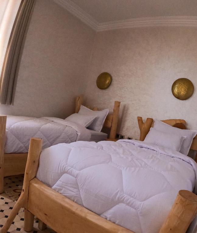 Postel nebo postele na pokoji v ubytování kasbah yu palace