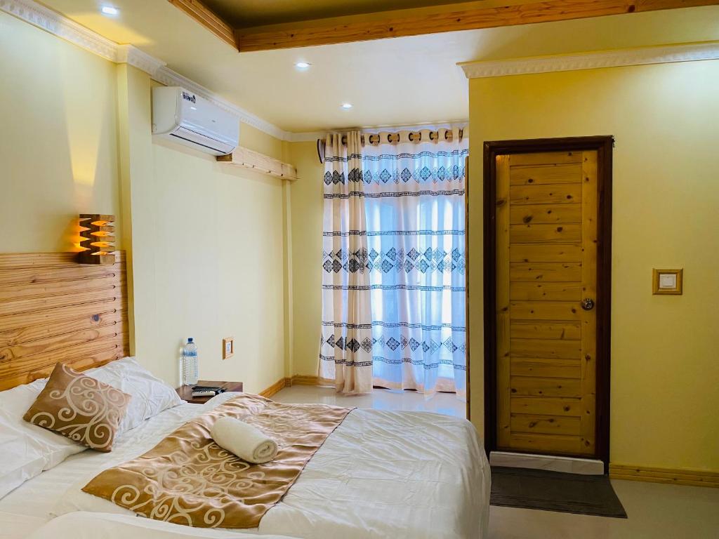 Postel nebo postele na pokoji v ubytování Mariana Maldives