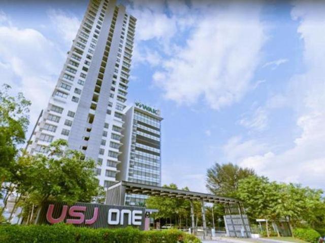 a tall building with a us one sign in front of it at Usj One Residence @ Homestay in Subang Jaya