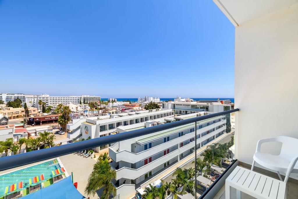 a view of the city from the balcony of a building at Seasons Hotel (Adults Only) in Ayia Napa