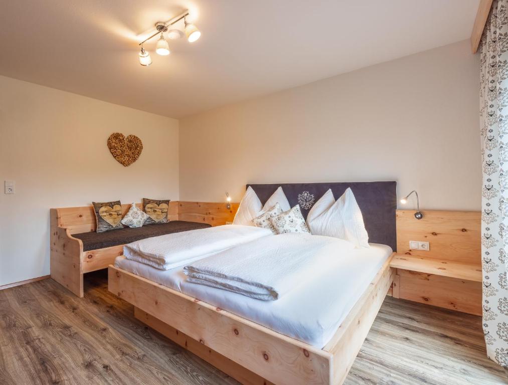 Postel nebo postele na pokoji v ubytování Haus Rabl