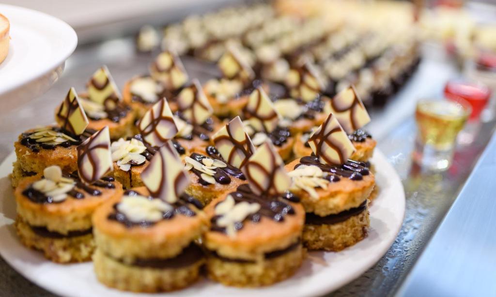 a plate of pastries with chocolate and marshmallows at Seasons Hotel (Adults Only) in Ayia Napa