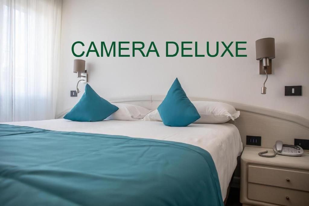 Ein Bett oder Betten in einem Zimmer der Unterkunft Albergo Cappello e Cadore