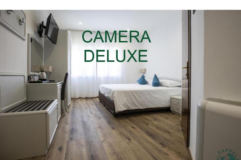 Voodi või voodid majutusasutuse Albergo Cappello e Cadore toas