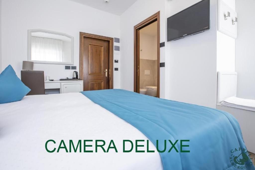 Voodi või voodid majutusasutuse Albergo Cappello e Cadore toas