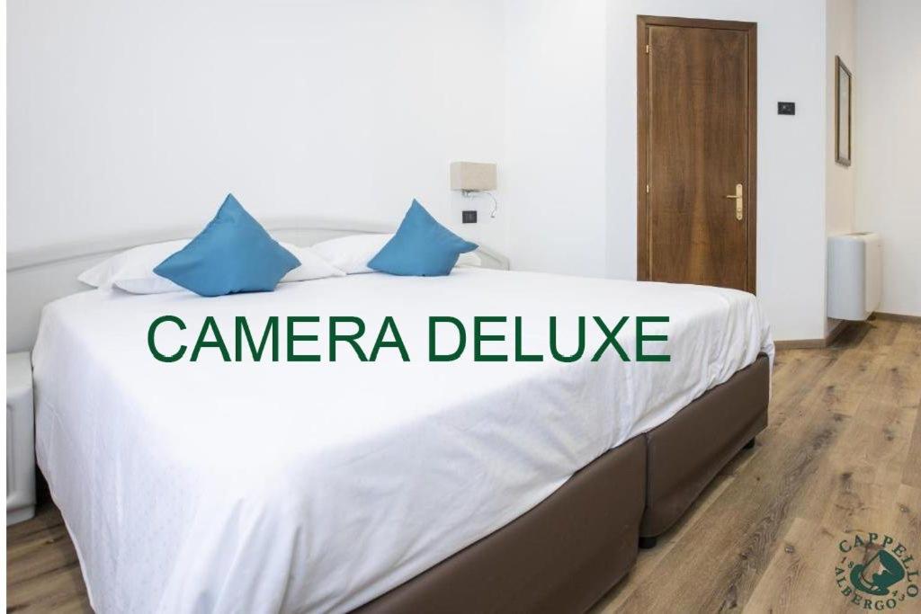 Ein Bett oder Betten in einem Zimmer der Unterkunft Albergo Cappello e Cadore
