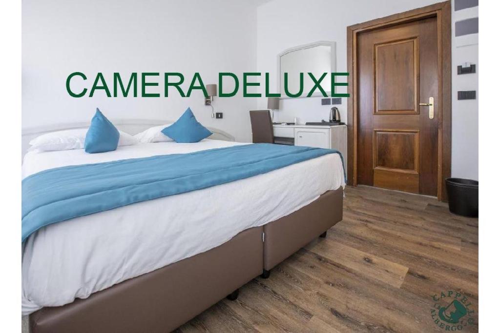 Voodi või voodid majutusasutuse Albergo Cappello e Cadore toas
