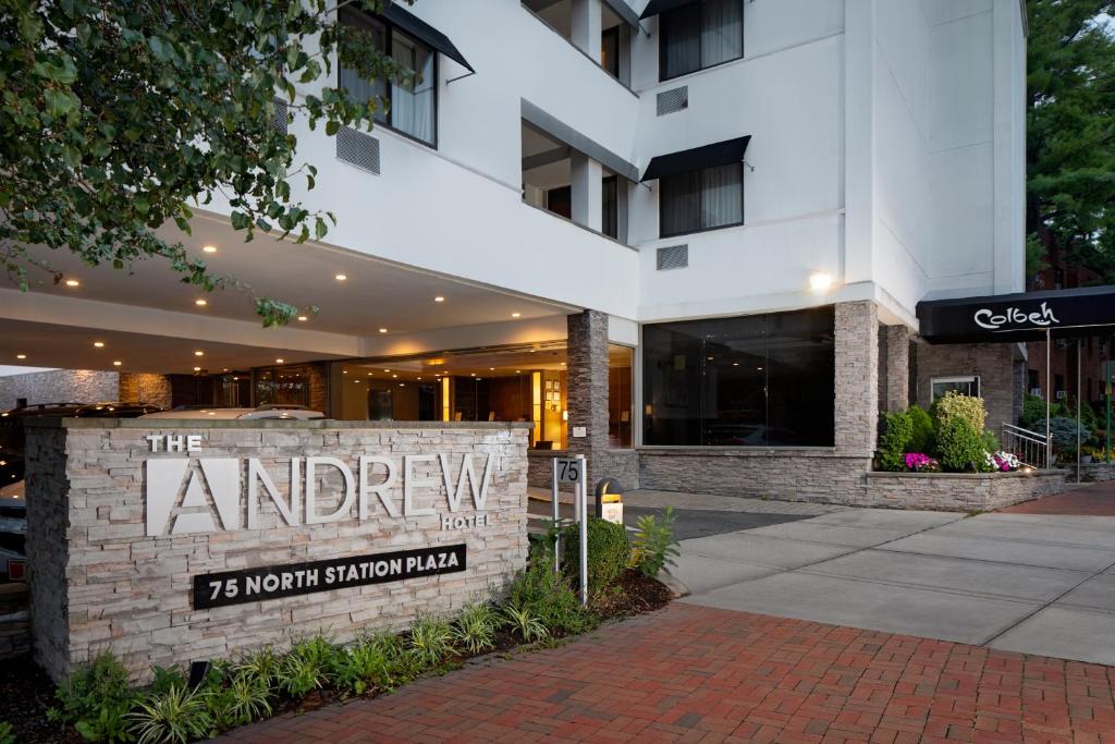 a building with a sign that reads the library at The Andrew Hotel in Great Neck