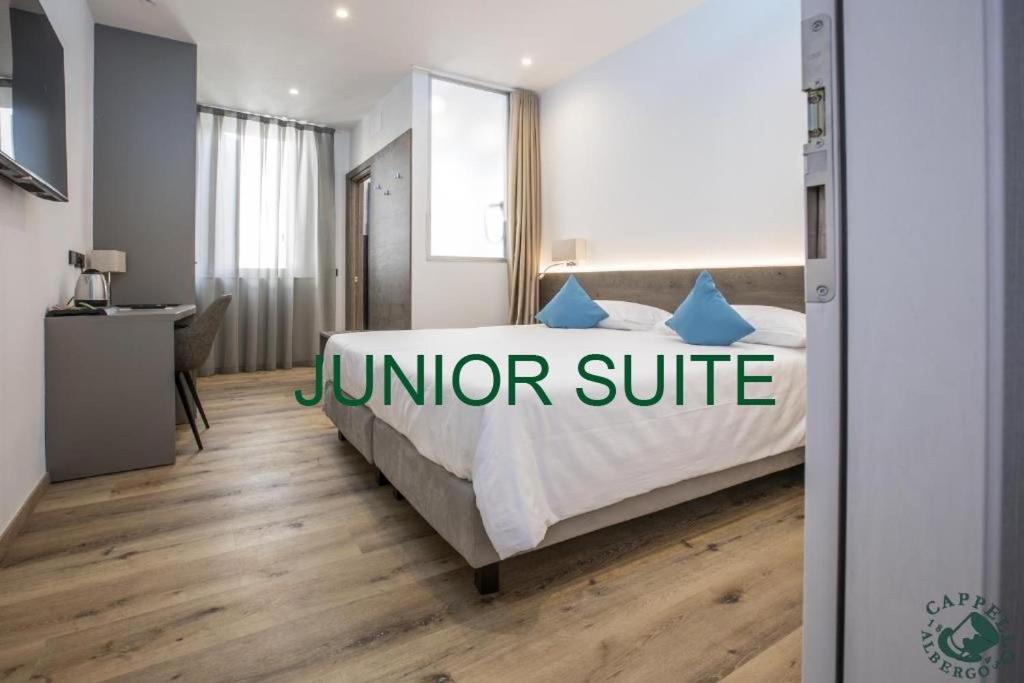 Voodi või voodid majutusasutuse Albergo Cappello e Cadore toas