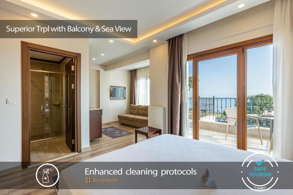 a view of a room with a bed and a balcony at MENAR HOTEL&SUITES -Old City Sultanahmet in Istanbul