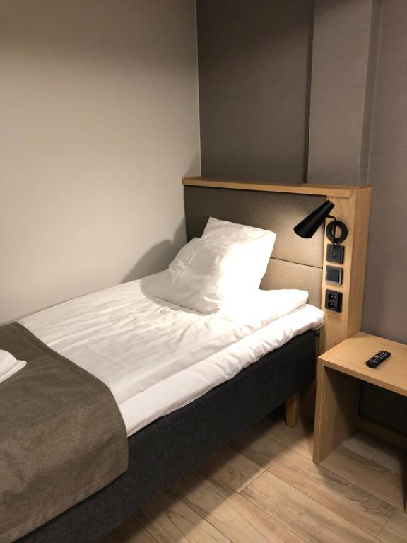 Postel nebo postele na pokoji v ubytování HOSTEL TOIVOLA