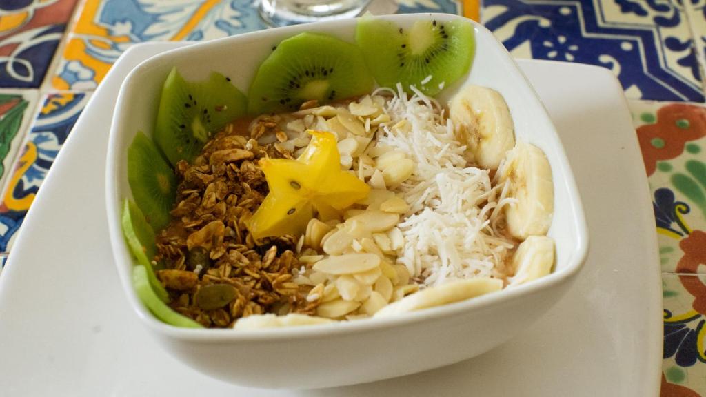 a bowl of food with nuts and fruit on a table at Casa Losodeli & Coworking- Adults Only in Puerto Escondido