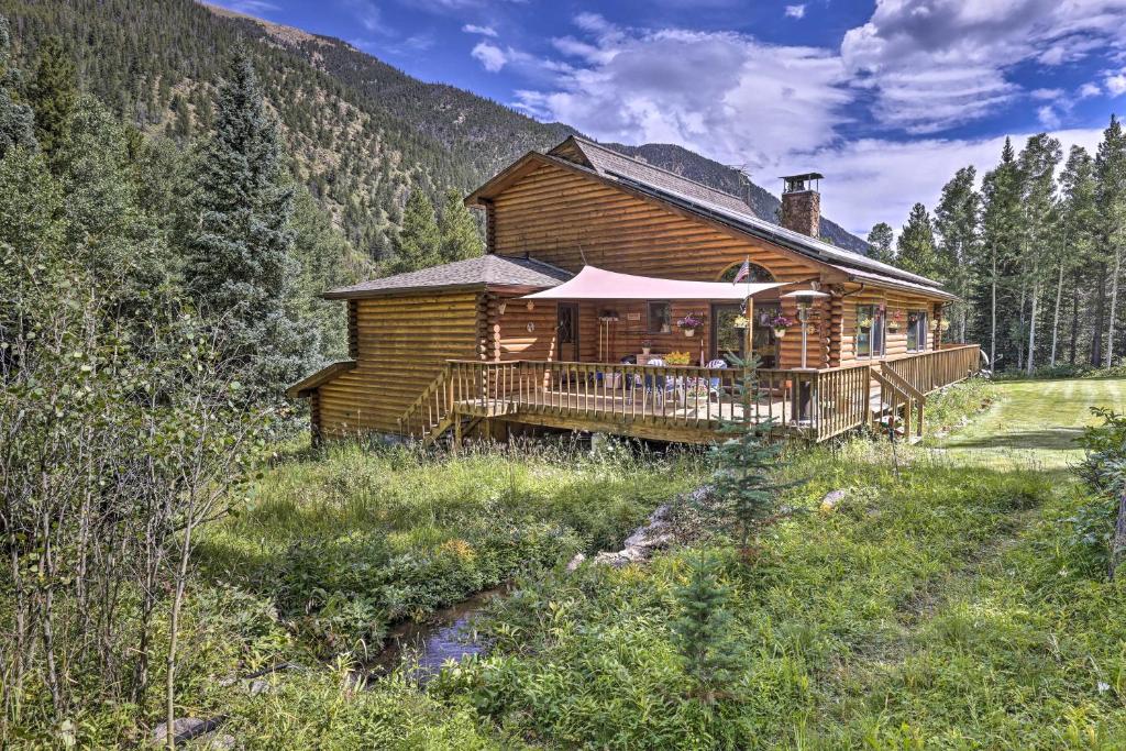 a log cabin in the middle of a mountain at Silver Plume Mountain Haven with Views and Deck! in Silver Plume