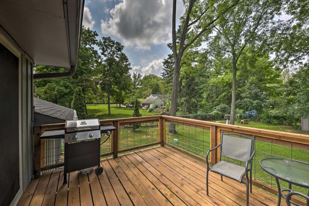 a deck with a stove and a table and chairs at Home - 2 Blocks to Lake Nagawicka Boat Launch in Delafield