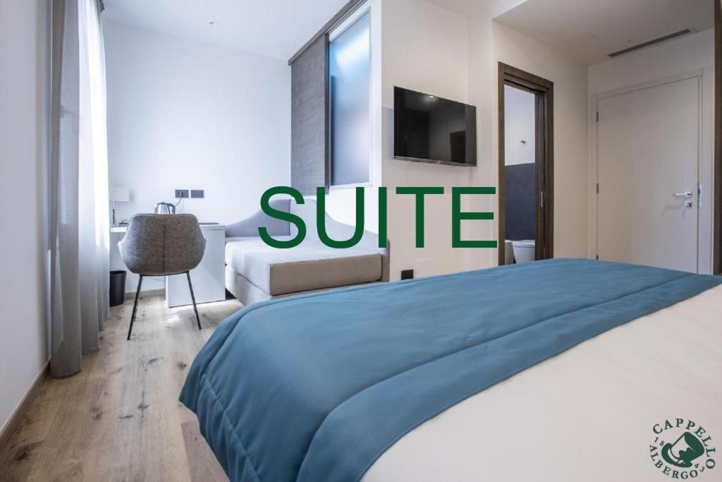 Voodi või voodid majutusasutuse Albergo Cappello e Cadore toas