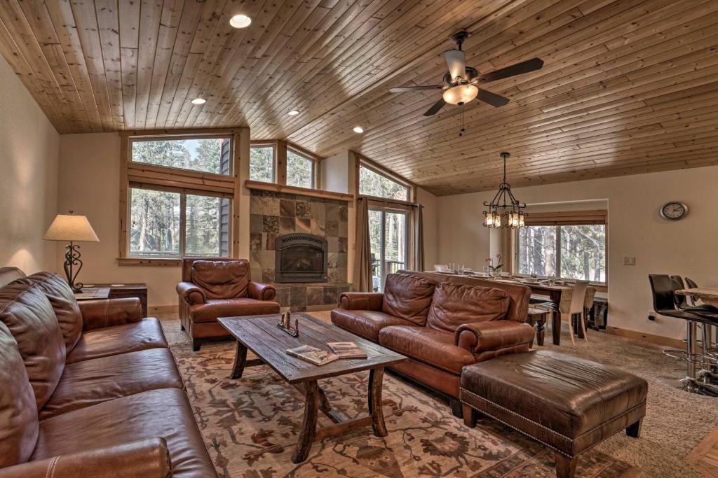 a living room with leather furniture and a piano at Soda Springs Cabin Near Donner Lake and Ski Resorts! in Soda Springs