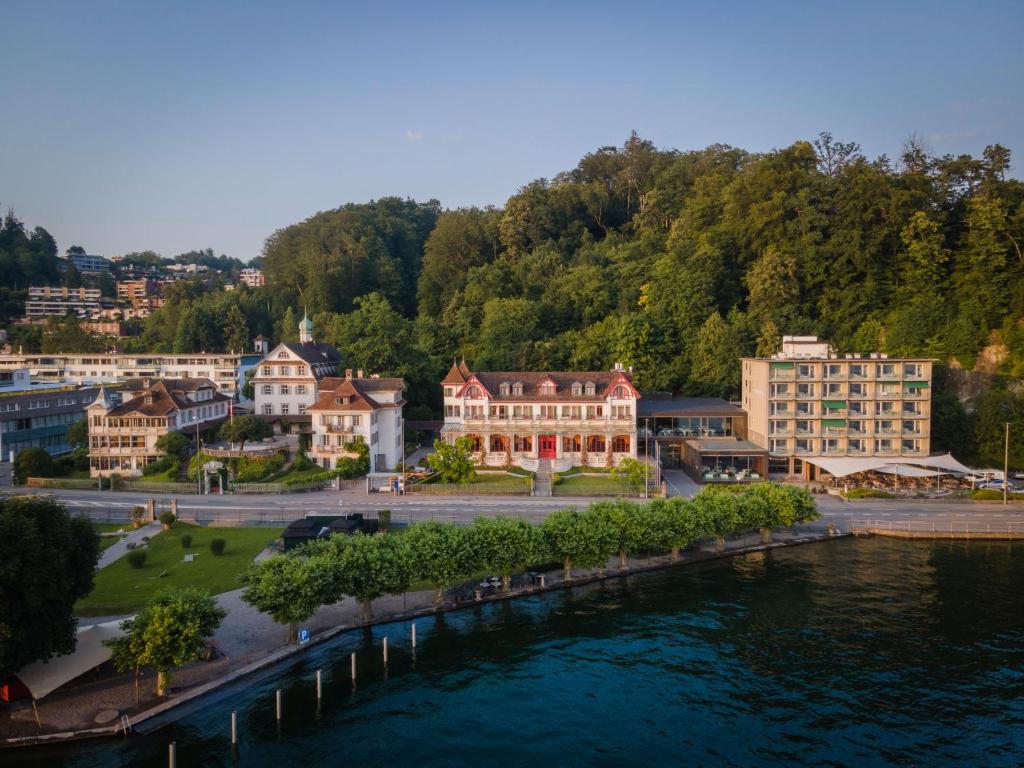 an aerial view of a town with a river and buildings at Hotel Seeburg in Lucerne