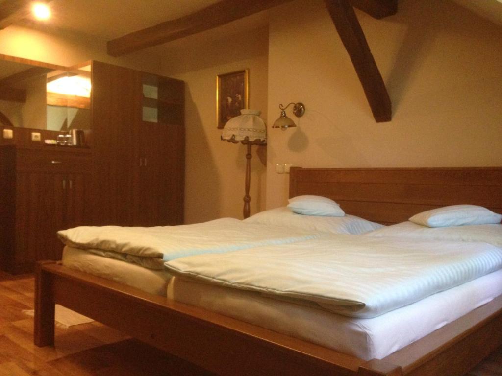 Postel nebo postele na pokoji v ubytování Hotel Starý Mlýn