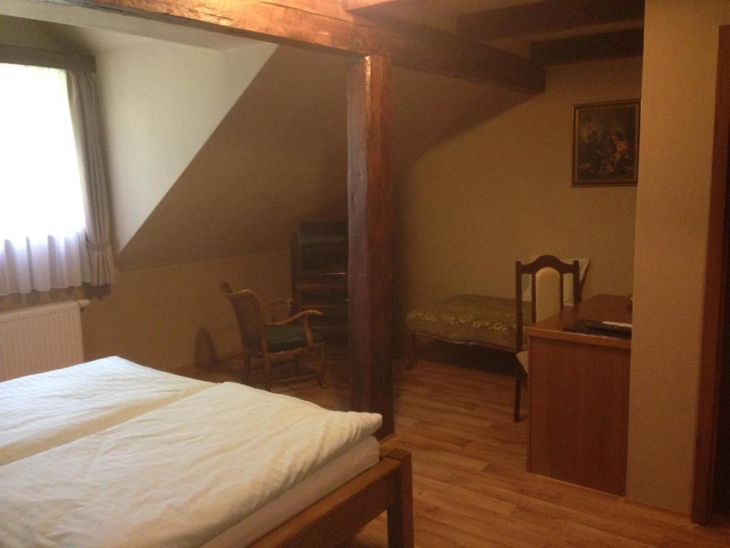 Postel nebo postele na pokoji v ubytování Hotel Starý Mlýn