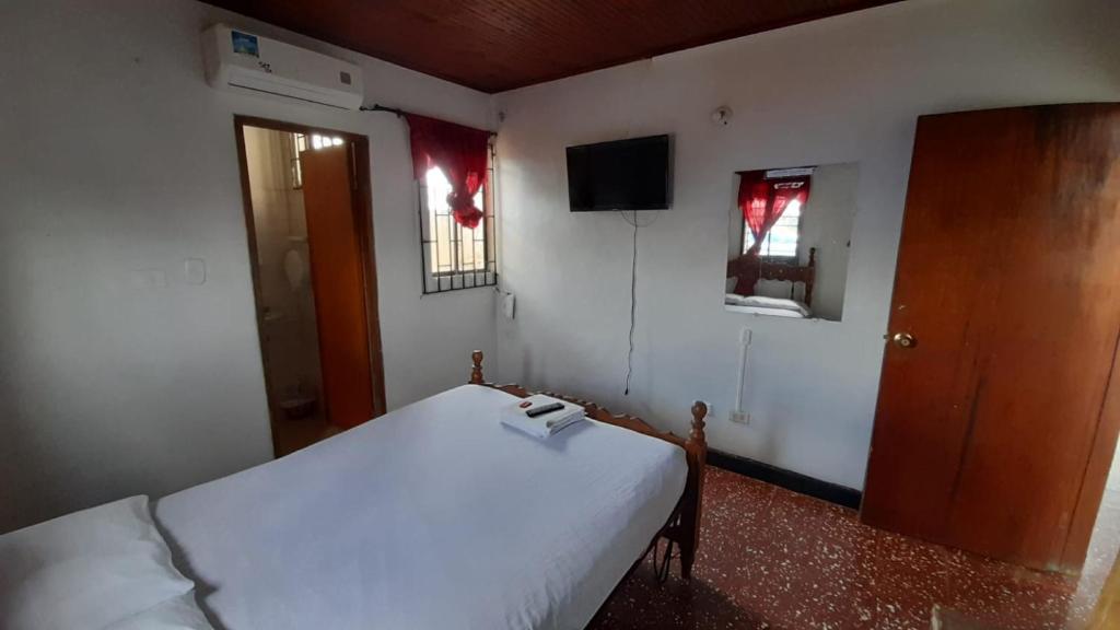 Postel nebo postele na pokoji v ubytování HOTEL en MONTERIA CITY