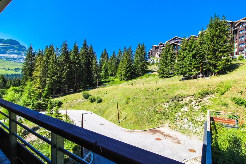 a view from the balcony of a apartment building with a skate park at Spacious Family 2-bed, 2-bath with parking, private piste in Flaine