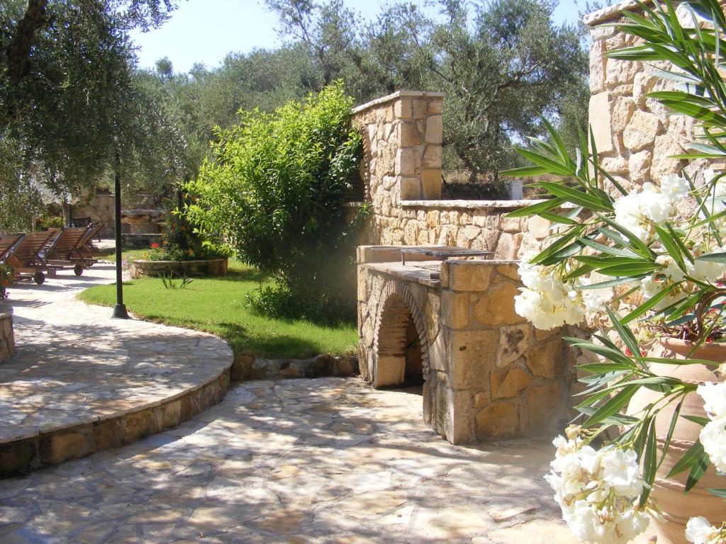 A garden outside Olive Tree Villas