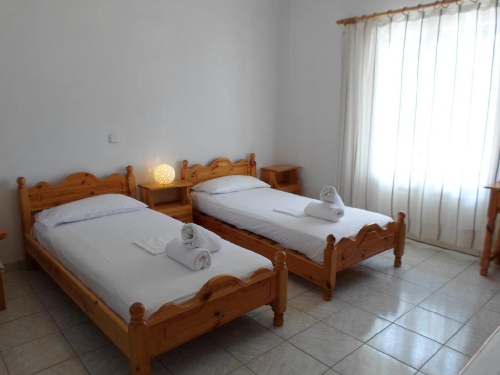 Postel nebo postele na pokoji v ubytování Katerina Apartments