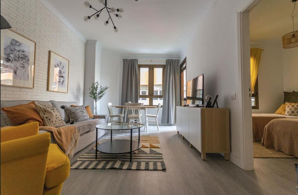 a living room with a couch and a table at City center nearby the beach +3Bed +2Bath +Wifi in Las Palmas de Gran Canaria