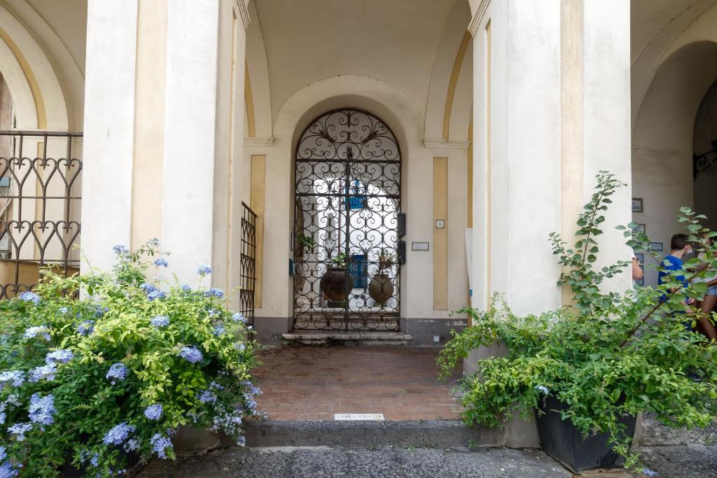 an entrance to a building with a stained glass door at Qasar Luxury Suite - in Capri's Piazzetta in Capri