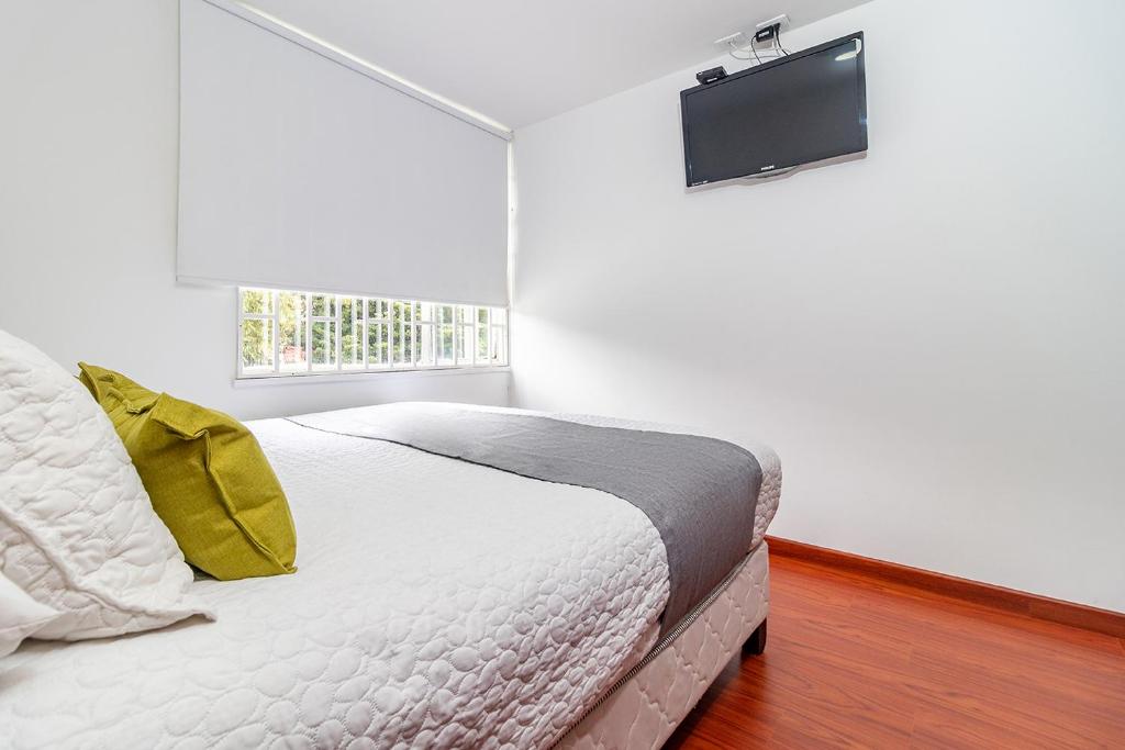 Postel nebo postele na pokoji v ubytování Hotel Harrington 63
